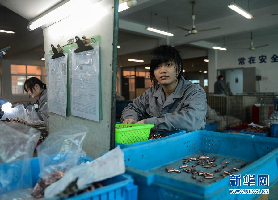 Zhong Xiaoxiao, 23, is a graduate from Zeguo town of Wenling City, Zhejiang. She now works in a factory as quality inspector. Photo taken on Feb. 17. (Xinhua/ Han Chuanhao)  