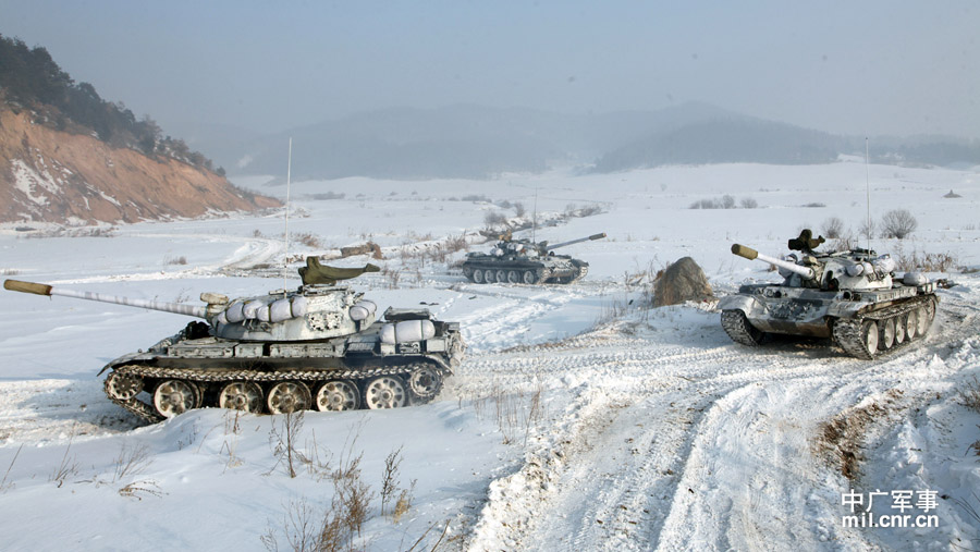 The tank echelon of an armored brigade under the Shenyang Military Area Command (MAC) of the Chinese People's Liberation Army (PLA) recently completed training on eight subjects, including command and control, concealing and camouflage, anti-interference and rush repair on battlefield etc., and conducted all-dimensional test of equipment's technical performance, personnel's equipment operation capability and tactical coordination and command under frigid weather conditions, greatly enhancing the combat and command capabilities of the troop unit under severely cold conditions. (mil.cnr.cn)