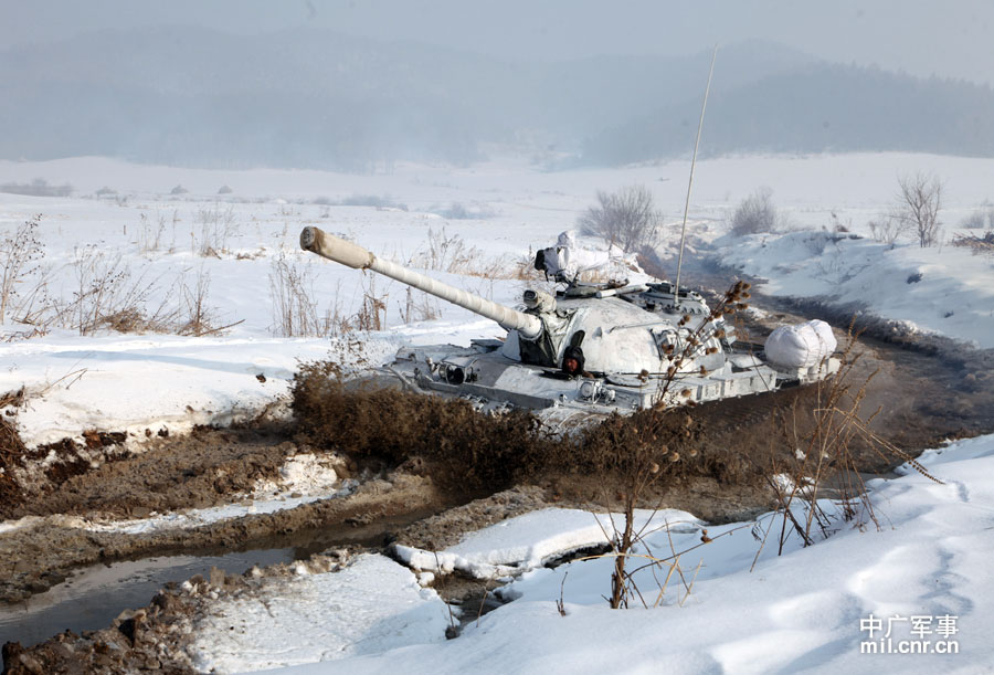 The tank echelon of an armored brigade under the Shenyang Military Area Command (MAC) of the Chinese People's Liberation Army (PLA) recently completed training on eight subjects, including command and control, concealing and camouflage, anti-interference and rush repair on battlefield etc., and conducted all-dimensional test of equipment's technical performance, personnel's equipment operation capability and tactical coordination and command under frigid weather conditions, greatly enhancing the combat and command capabilities of the troop unit under severely cold conditions. (mil.cnr.cn)