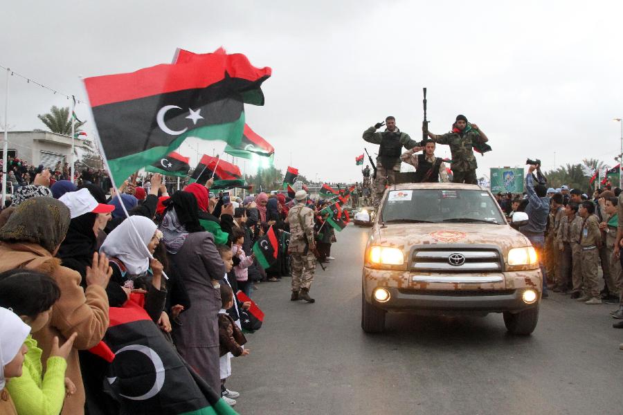 Libyan soldiers demonstrate their skills during a military parade for the second anniversary of a political upheaval that toppled former leader Muammar Gaddafi in the Libyan capital Tripoli, on Feb. 21, 2013 (Xinhua/Hamza Turkia) 