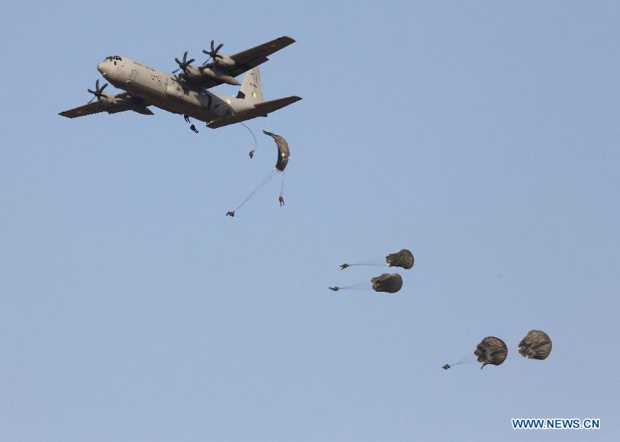 Photo taken on Feb. 21, 2013 shows an aircraft during the full dress rehearsal for the Indian Air Force's Iron Fist 2013 military exercise in Pokhran of the state of Rajasthan, India. (Xinhua/Stringer)