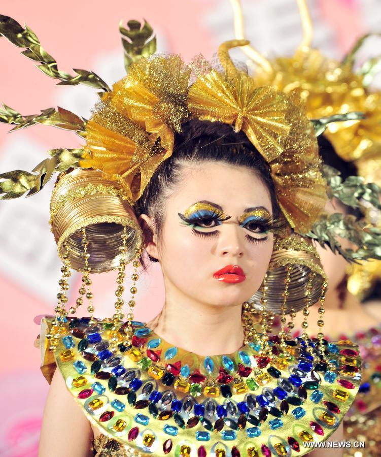 A model presents a make-up design at the 23rd International Cosmetics Exhibition at Taipei World Trade Center in Taipei, southeast China's Taiwan, Feb. 22, 2013. Opened Friday, the five-day event attracted some 160 exhibitors. (Xinhua/Wu Ching-teng) 