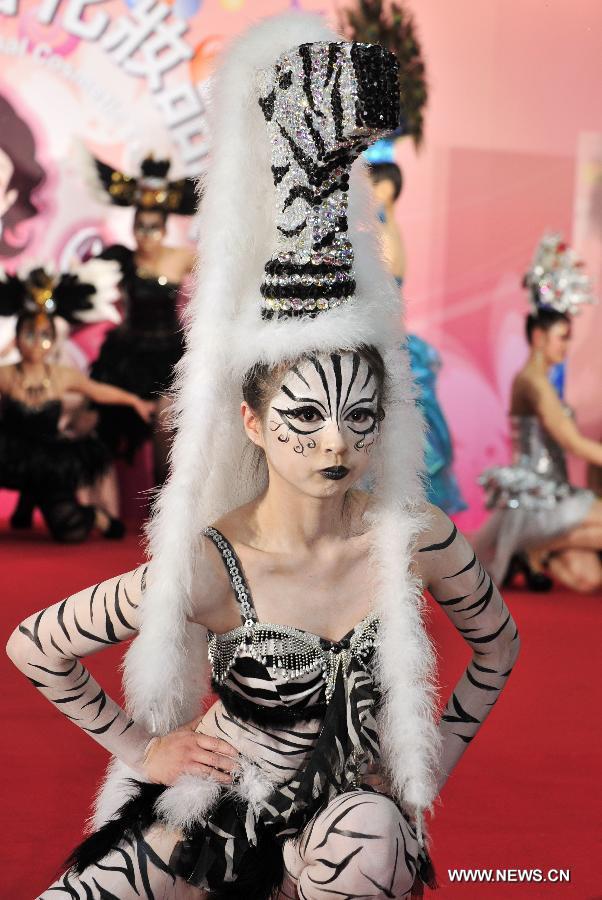 A model presents a make-up design at the 23rd International Cosmetics Exhibition at Taipei World Trade Center in Taipei, southeast China's Taiwan, Feb. 22, 2013. Opened Friday, the five-day event attracted some 160 exhibitors. (Xinhua/Wu Ching-teng) 