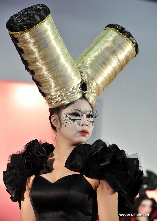 A model presents a make-up design at the 23rd International Cosmetics Exhibition at Taipei World Trade Center in Taipei, southeast China's Taiwan, Feb. 22, 2013. Opened Friday, the five-day event attracted some 160 exhibitors. (Xinhua/Wu Ching-teng) 