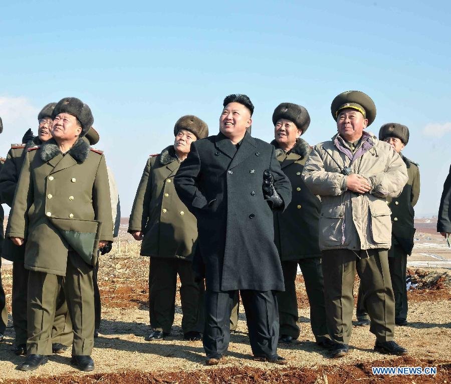 This undated picture released by Korean Central News Agency (KCNA) on Feb. 23, 2013 shows top leader of the Democratic People's Republic of Korea (DPRK) Kim Jong Un (C) watching a flight exercise and a paratrooping drill of the Air Force and Anti-Air Force and Large Combined Unit 630. (Xinhua/ Korean Central News Agency)