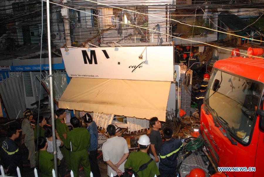 Rescuers work at a collapsed building after an explosion in Ho Chi Minh City, Vietnam, on Feb. 24, 2013. A total of seven people were confirmed dead and three went missing after three houses in a small alley in south Vietnam's Ho Chi Minh City's District 3 collapsed following two explosions at dawn on Sunday, said the police. (Xinhua/VNA)