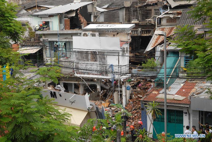 Photo taken on Feb. 24, 2013 shows a collapsed building after an explosion in Ho Chi Minh City, Vietnam. A total of seven people were confirmed dead and three went missing after three houses in a small alley in south Vietnam's Ho Chi Minh City's District 3 collapsed following two explosions at dawn on Sunday, said the police. (Xinhua/VNA) 