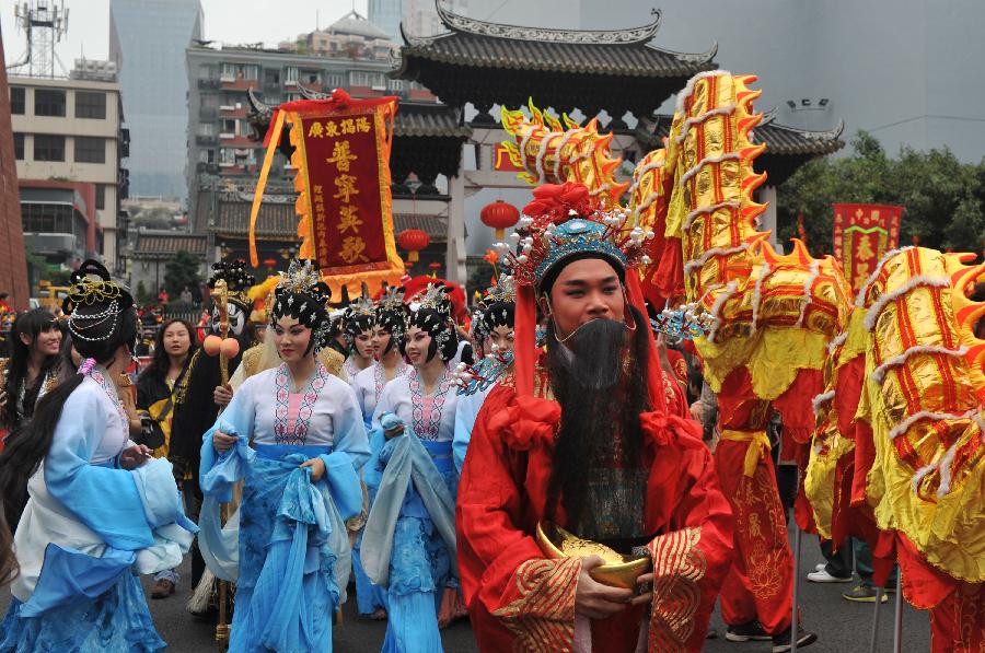 Artists perform at a temple fair in Guangzhou, capital of south China's Guangdong Province, Feb. 24, 2013. The 7-day-long temple fair, as a cultural carnival, will showcase various cultural forms such as folk customs, praying culture and cuisine culture. (Xinhua/Lu Hanxin) 