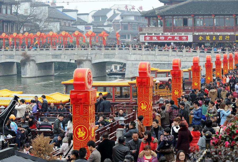 Visitors are seen at the Confucius Temple in Nanjing, capital of east China's Jiangsu Province, Feb. 24, 2013. On the Lantern Festival, tens of thousands of visitors came to the Confucius Temple, a famous tourist destination in Nanjing. (Xinhua/Sun Can)