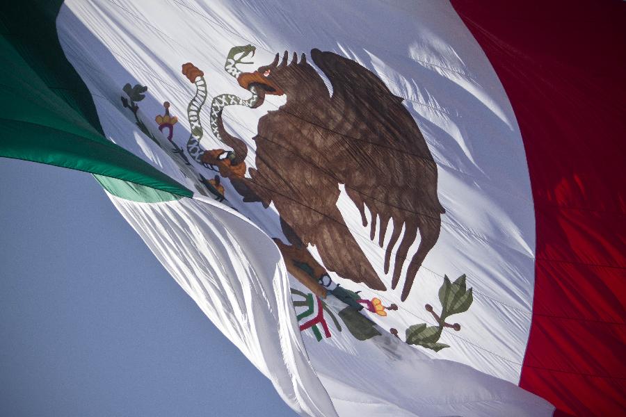 Mexican National Flag waves during a ceremony to commemorate the National Flag Day held at the Marte Military Camp, in Mexico City, capital of Mexico, Feb. 24, 2013. (Xinhua/Rodrigo Oropeza) 