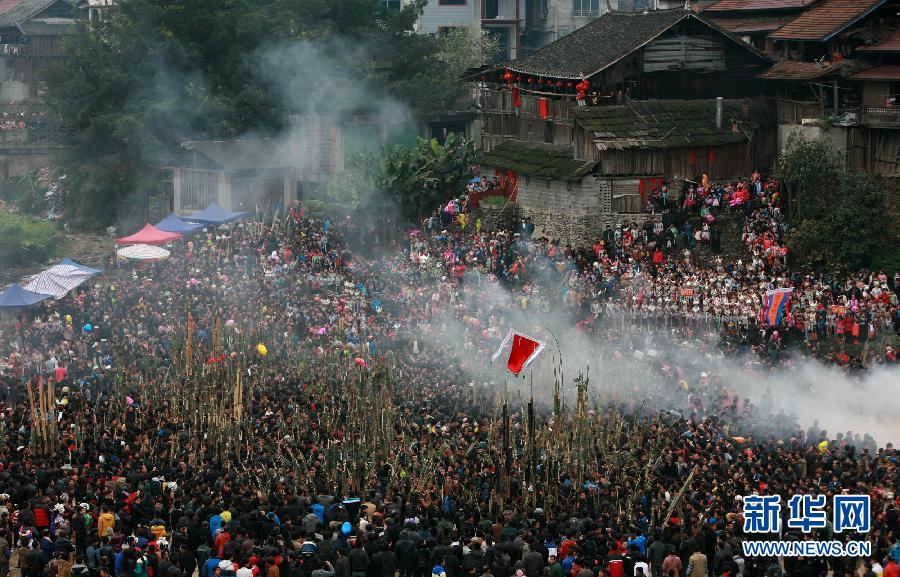 A Lusheng instrument playing competition is held in Rongshui Miao autonomous county in Guangxi on Feb. 12, 2013. It is a traditional local cultural activity. (Xinhua/Long Tao)