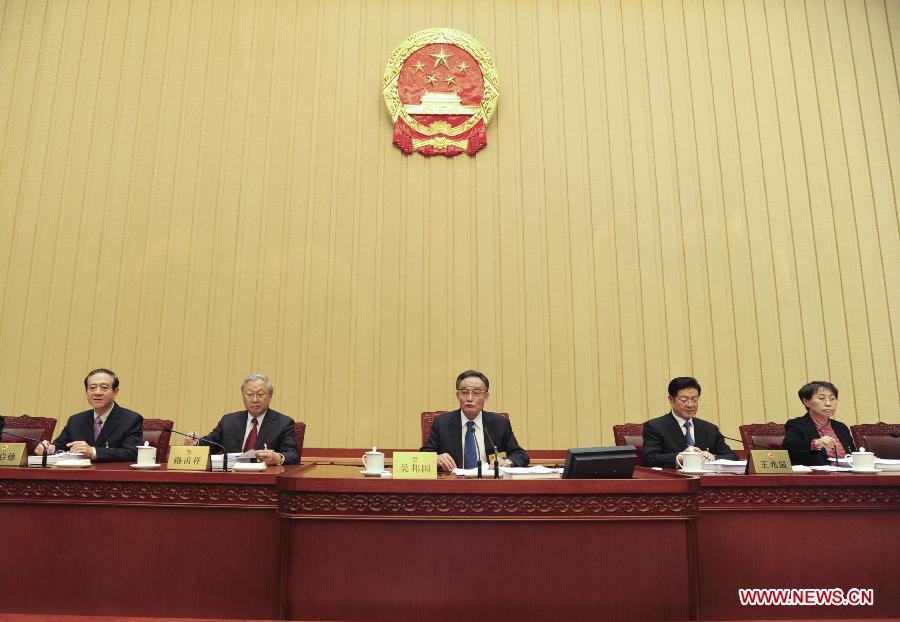 Wu Bangguo (C), chairman of the Standing Committee of the National People's Congress (NPC), presides over a meeting of the 31st session of the 11th NPC Standing Committee in Beijing, capital of China, Feb. 25, 2013. (Xinhua/Xie Huanchi)