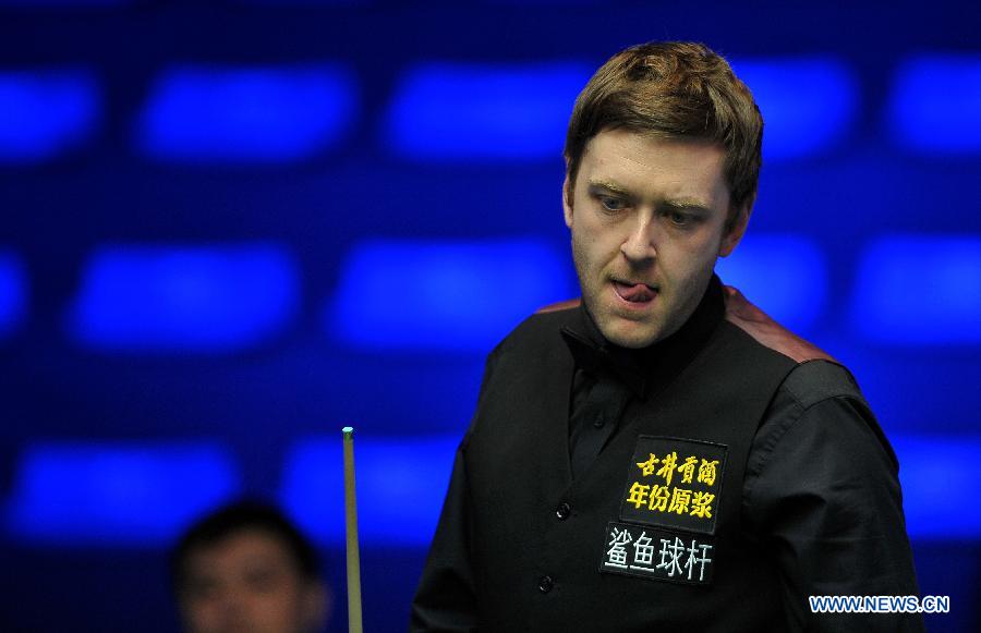 Ricky Walden of England reacts during the first round match against Peter Ebdon of England at the Haikou World Open snooker tournament in Haikou, capital of south China's Hainan Province, Feb. 25, 2013. Walden won 5-2. (Xinhua/Guo Cheng)