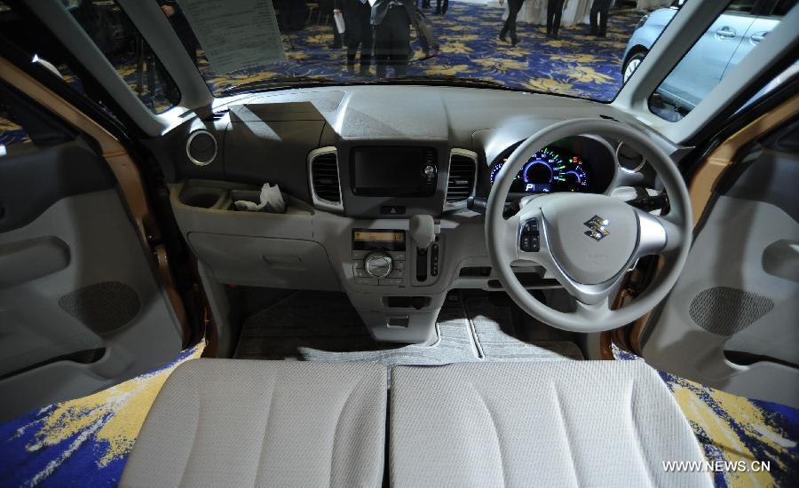 The interview of new minicar "Spacia" of Japan's auto maker Suzuki Motor Osamu Suzuki is seen during a press conference in Tokyo, capital of Japan, on Feb. 26, 2013. Suzuki introduced the new mini car "Spacia" on Tuesday. (Xinhua/Kenichiro Seki) 