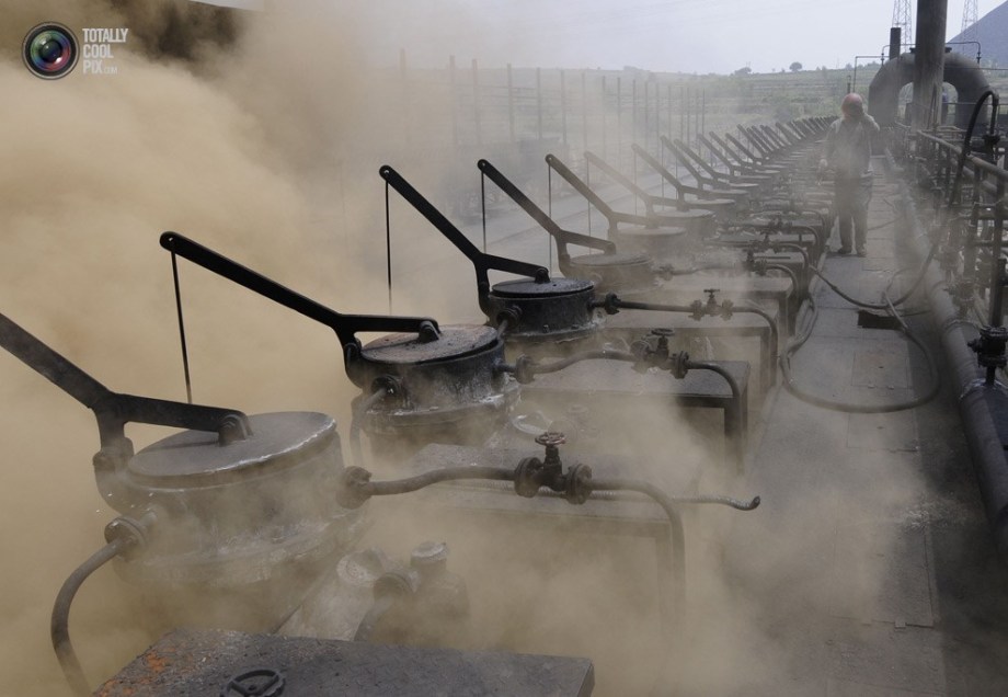 A worker walks past a coke oven in a coking manufactory in Changzhi. (File Photo)