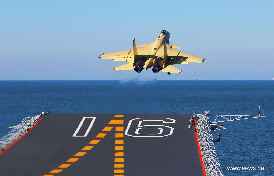 This undated photo shows a carrier-borne J-15 fighter jet taking off from China's first aircraft carrier, the Liaoning.  (Xinhua/Zha Chunming) 