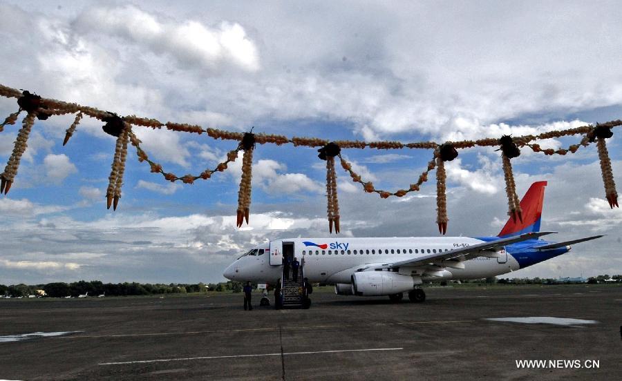 A Russian-made commercial plane Sukhoi Super Jet 100 (SSJ 100) lands at Halim Perdana Kusuma Airport in Jakarta, Indonesia, Feb. 28, 2013. An Indonesian airlines firm, Sky Aviation, received on Wednesday the initial delivery of SSJ 100, expecting five to join the fleet by the end of this year. (Xinhua/Agung Kuncahya B.) 