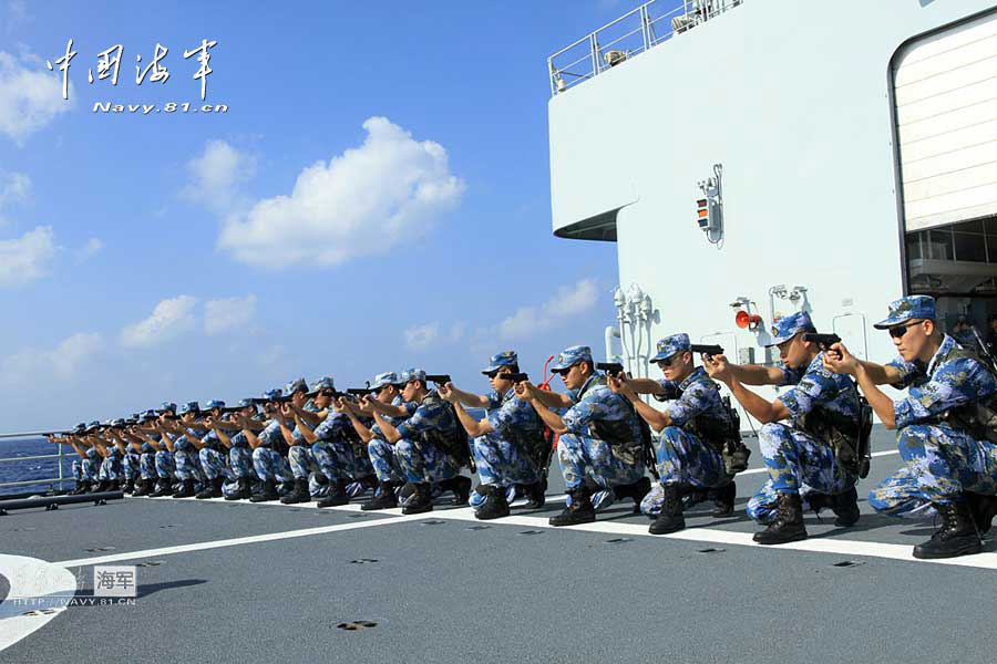 The 14th escort taskforce under the Navy of the Chinese People's Liberation Army (PLA) organizes its special operation members from the Harbin guided missile destroyer, the Mianyang guided missile frigate and the Weishan Lake comprehensive supply ship to conduct a precision shooting training with pistol and rifle on February 27, 2013. (navy.81.cn/Qin Chuan, Li Ding, Yang Qinghai)