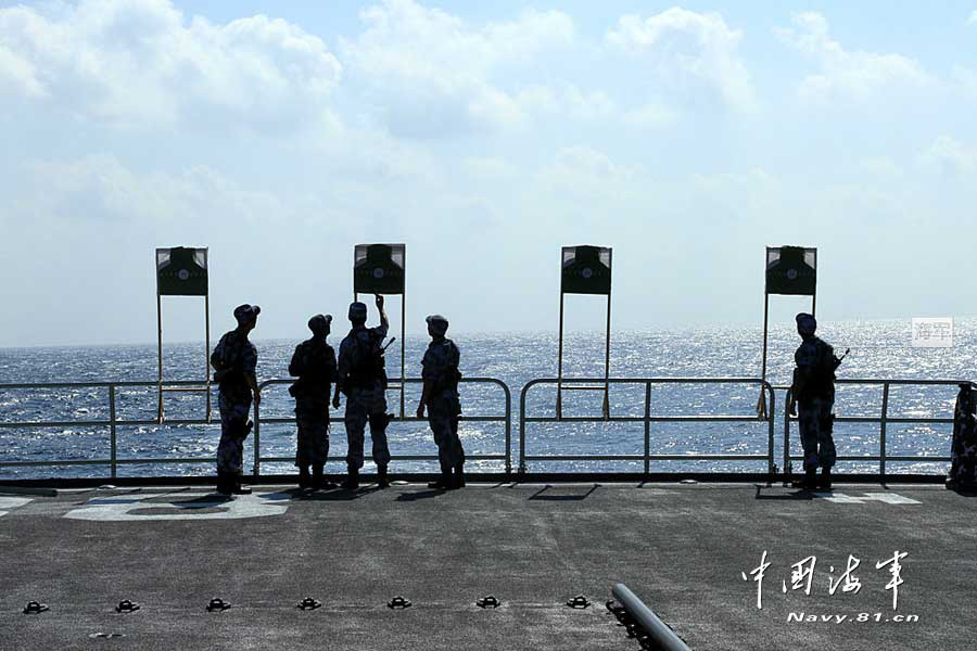 The 14th escort taskforce under the Navy of the Chinese People's Liberation Army (PLA) organizes its special operation members from the Harbin guided missile destroyer, the Mianyang guided missile frigate and the Weishan Lake comprehensive supply ship to conduct a precision shooting training with pistol and rifle on February 27, 2013. (navy.81.cn/Qin Chuan, Li Ding, Yang Qinghai)