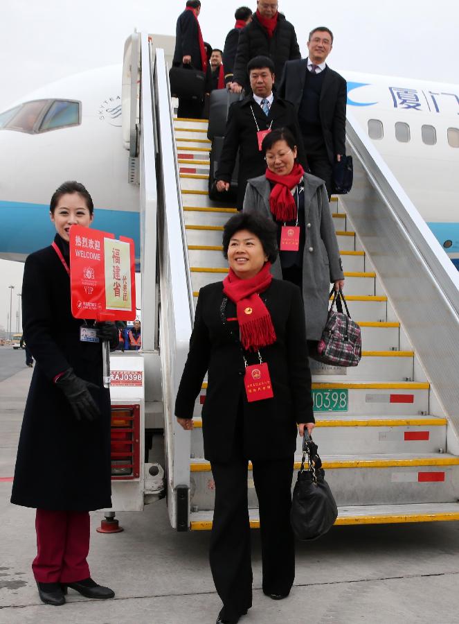 Deputies to the 12th National People's Congress (NPC) from southeast China's Fujian Province arrive in Beijing, capital of China, March 2, 2013. The first session of the 12th NPC is scheduled to open in Beijing on March 5. (Xinhua/Pang Xinglei)