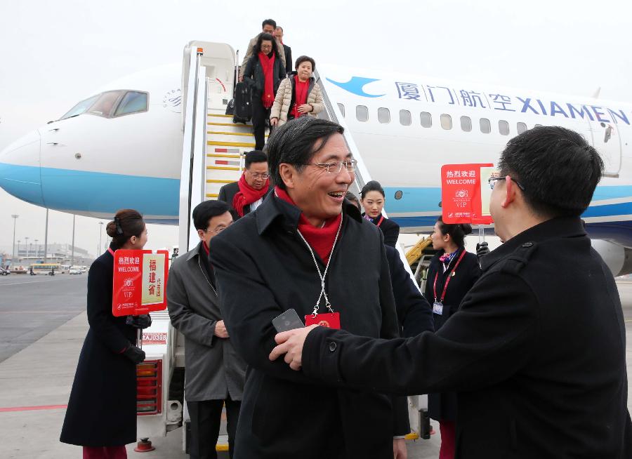 Deputies to the 12th National People's Congress (NPC) from southeast China's Fujian Province arrive in Beijing, capital of China, March 2, 2013. The first session of the 12th NPC is scheduled to open in Beijing on March 5. (Xinhua/Pang Xinglei)