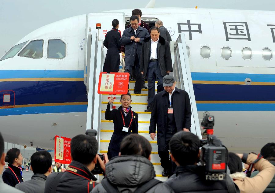 Deputies to the 12th National People's Congress (NPC) from northeast China's Heilongjiang Province arrive in Beijing, capital of China, March 2, 2013. The first session of the 12th NPC is scheduled to open in Beijing on March 5. (Xinhua/Wang Song)