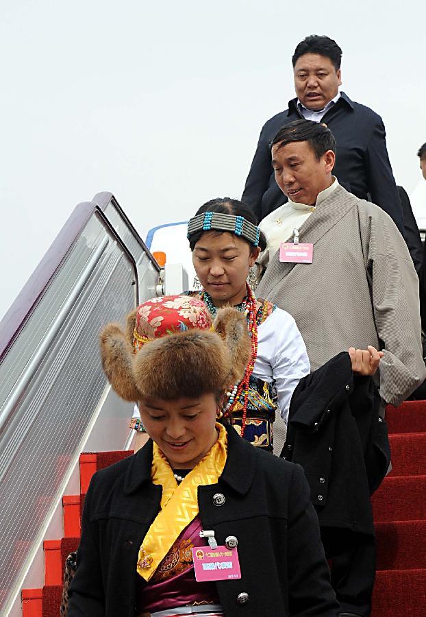 Deputies to the 12th National People's Congress (NPC) from southwest China's Tibet Autonomous Region arrive in Beijing, capital of China, March 2, 2013. The first session of the 12th NPC is scheduled to open in Beijing on March 5. (Xinhua/Wang Song)