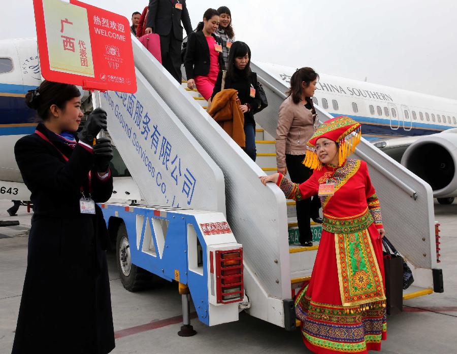 Deputies to the 12th National People's Congress (NPC) from south China's Guangxi Zhuang Autonomous Region arrive in Beijing, capital of China, March 2, 2013. The first session of the 12th NPC is scheduled to open in Beijing on March 5. (Xinhua/Pang Xinglei)