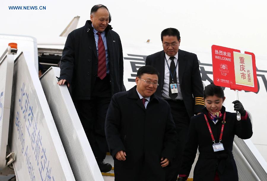 Deputies to the 12th National People's Congress (NPC) from southwest China's Chongqing Municipality arrive in Beijing, capital of China, March 2, 2013. The first session of the 12th NPC is scheduled to open in Beijing on March 5. (Xinhua/Pang Xinglei)