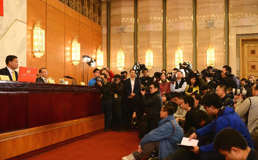 Lu Xinhua (1st L), spokesman of the first session of the 12th Chinese People's Political Consultative Conference (CPPCC) National Committee, speaks during a news conference on the CPPCC session in Beijing, capital of China, March 2, 2013. The first session of the 12th CPPCC National Committee is scheduled to open in Beijing on March 3. (Xinhua/Jin Liangkuai)