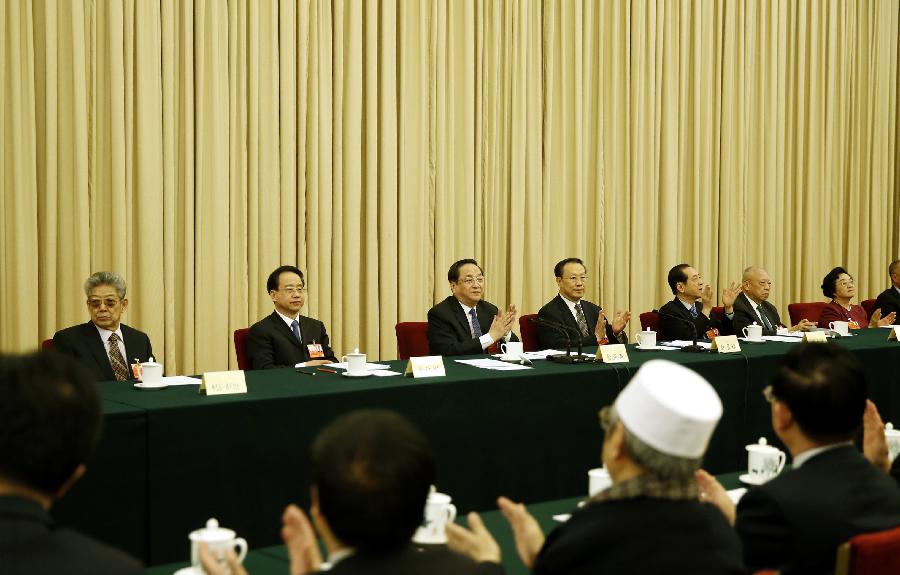 The presidium of the first session of the 12th National Committee of the Chinese People's Political Consultative Conference (CPPCC) hold their first meeting at the Great Hall of the People in Beijing, capital of China, March 2, 2013. (Xinhua/Ju Peng) 