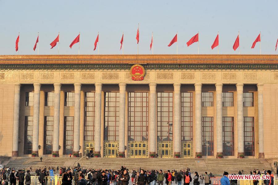 Journalists wait to enter the Great Hall of the People in Beijing, capital of China, March 5, 2013. The first session of the 12th National People's Congress (NPC) will open in Beijing on March 5. (Xinhua/Guo Chen)