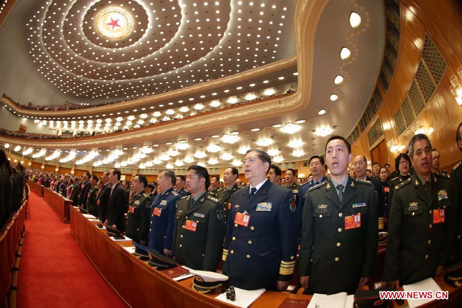 Deputies sing the national anthem during the opening meeting of the first session of the 12th National People's Congress (NPC) at the Great Hall of the People in Beijing, capital of China, March 5, 2013. (Xinhua/Li Gang)