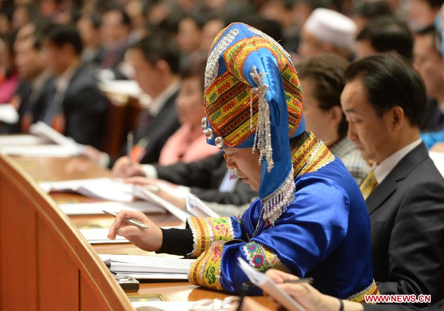 Deputies listen during the opening meeting of the first session of the 12th National People's Congress (NPC) at the Great Hall of the People in Beijing, capital of China, March 5, 2013. (Xinhua/Wang Jianhua)