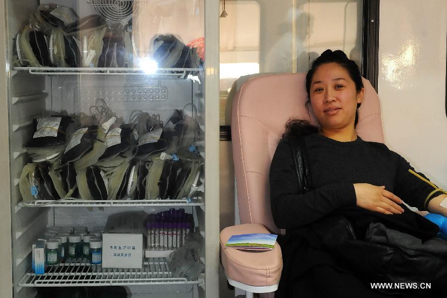 A citizen donates blood in Taiyuan, capital of north China's Shanxi Province, March 5, 2013, as an effort to learn from Lei Feng, a young Chinese soldier in the 1960s, who is known for devoting almost all of his spare time and money to selflessly helping the needy. Lei died after being hit by a falling pole while helping a fellow soldier direct a truck on Aug. 15, 1962. A year later, late Chinese leader Chairman Mao Zedong called on the nation to follow Lei's example, and March 5 of every year is designated as "Lei Feng Day." (Xinhua/Fan Minda)