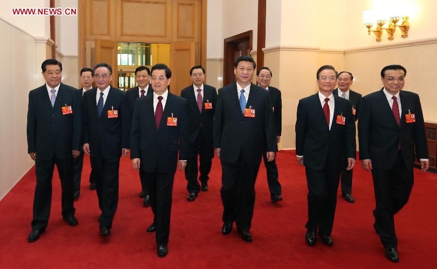 Hu Jintao, Xi Jinping, Wu Bangguo, Wen Jiabao, Jia Qinglin, Li Keqiang, Zhang Dejiang, Yu Zhengsheng, Liu Yunshan, Wang Qishan and Zhang Gaoli walk to the venue for the opening meeting of the first session of the 12th National People's Congress (NPC) at the Great Hall of the People in Beijing, capital of China, March 5, 2013. The first session of the 12th NPC opened in Beijing on March 5. (Xinhua/Lan Hongguang)