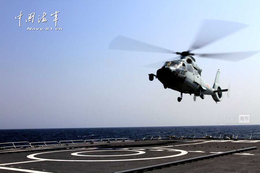 The 14th escort taskforce under the Navy of the Chinese People's Liberation Army (PLA) organizes taking off and landing training for its two ship-borne helicopters aboard the Harbin guided missile destroyer, the Mianyang guided missile frigate and the Weishan Lake comprehensive supply ship. (navy.81.cn/Dong Xiguang, Li Ding, Yang Qinghai, Yang Shangjun, Zhang Mingxing)