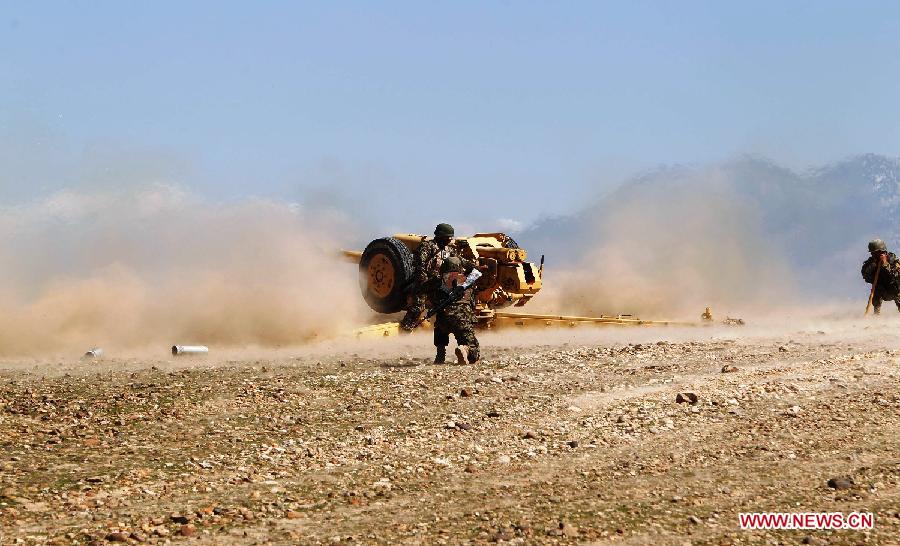 Afghan national army soldiers fire an artillery shell during a military exercise in Laghman province, east Afghanistan, on March 5, 2013. The Afghan government and NATO Training Mission in Afghanistan (NTM-A) have stepped up efforts to train and equip Afghan army and police to take over the full leadership of its own security duties. (Xinhua/Sapay)