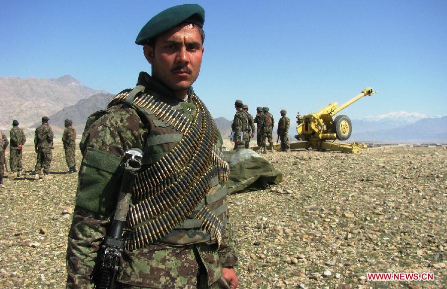 An Afghan national army soldier stands guard during a military exercise in Laghman province, east Afghanistan, on March 5, 2013. The Afghan government and NATO Training Mission in Afghanistan (NTM-A) have stepped up efforts to train and equip Afghan army and police to take over the full leadership of its own security duties. (Xinhua/Sapay)