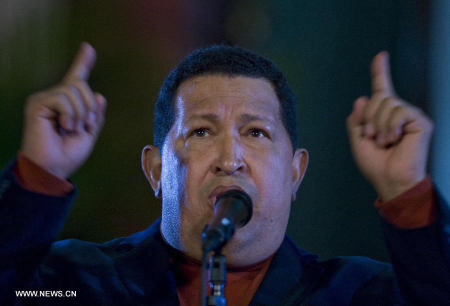 File photo taken on Oct. 6, 2012 shows Venezuelan President Hugo Chavez attending a press conference in Caracas, capital of Venezuela. Venezuelan government confirmed President Hugo Chavez's death on March 5, 2013. (Xinhua) 