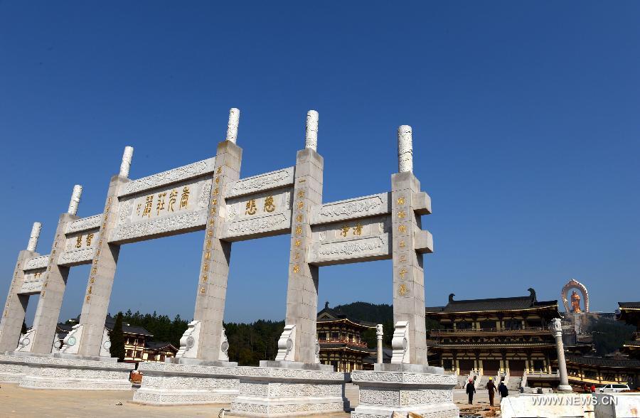 Photo taken on March 6, 2013 shows the entrance leading to the Donglin Buddha statue at the Donglin Temple in Xingzi County of Jiujiang City, east China's Jiangxi Province, March 6, 2013. The bronze statue of Amitabha Buddha, which is 48 meters in height, is believed to be the tallest of its kind in the world. The project, with the total cost of about 1 billion yuan (161 million U.S. dollars), has been basically completed. It was totally funded by private donations. (Xinhua/Song Zhenping)  