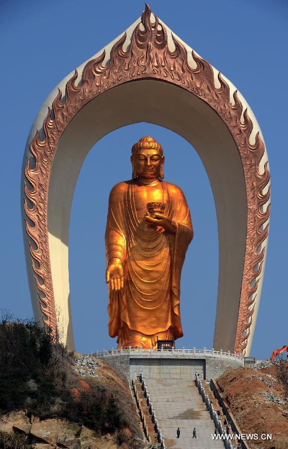 The Donglin Buddha statue is seen at the Donglin Temple in Xingzi County of Jiujiang City, east China's Jiangxi Province, March 6, 2013. The bronze statue of Amitabha Buddha, which is 48 meters in height, is believed to be the tallest of its kind in the world. The project, with the total cost of about 1 billion yuan (161 million U.S. dollars), has been basically completed. It was totally funded by private donations. (Xinhua/Song Zhenping)  