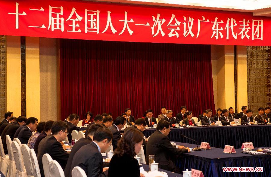 Deputies to the 12th National People's Congress (NPC) from south China's Guangdong Province take part in a discussion in Beijing, capital of China, March 6, 2013. The discussion which was held by the Guangdong delegation to the first session of the 12th NPC was open to media on Wednesday. (Xinhua/Liu Jinhai)