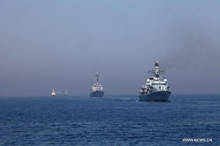 Naval ships from various countries are seen during the AMAN-13 exercise in the Arabian Sea, March 7, 2013. Naval ships from 14 countries, including China, the United States, Britain and Pakistan, joined a five-day naval drill in the Arabian Sea from March 4, involving 24 ships, 25 helicopters, and special forces. (Xinhua/Rao Rao)