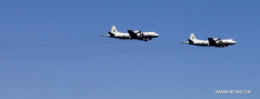 Pakistani P-3C Orion aircraft are seen during the AMAN-13 exercise in the Arabian Sea, March 8, 2013. Naval ships from 14 countries, including China, the United States, Britain and Pakistan, joined a five-day naval drill in the Arabian Sea from March 4, involving 24 ships, 25 helicopters, and special forces. (Xinhua/Rao Rao)