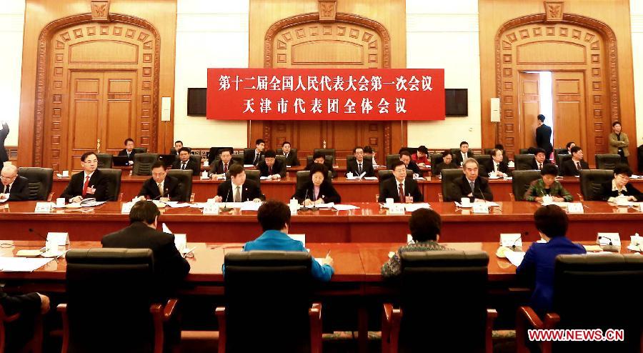 Deputies to the 12th National People's Congress (NPC) from north China's Tianjin Municipality take part in a discussion in Beijing, capital of China, March 9, 2013. The discussion which was held by the Tianjin delegation to the first session of the 12th NPC was open to media on Saturday. (Xinhua/Yue Yuewei)