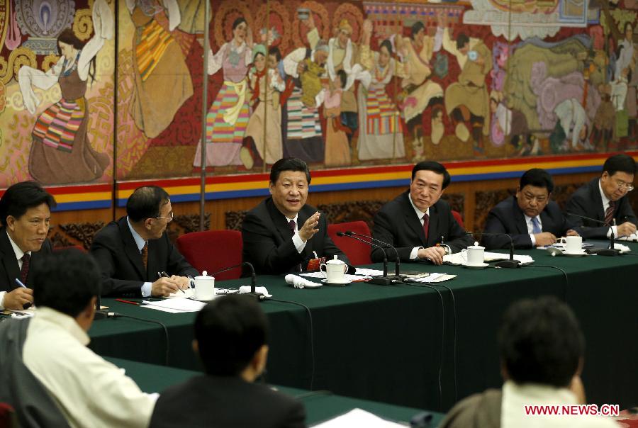 Xi Jinping (4th R), general secretary of the Central Committee of the Communist Party of China (CPC), joins a discussion with deputies from southwest China's Tibet Autonomous Region, who attend the first session of the 12th National People's Congress (NPC), in Beijing, capital of China, March 9, 2013. (Xinhua/Ju Peng)