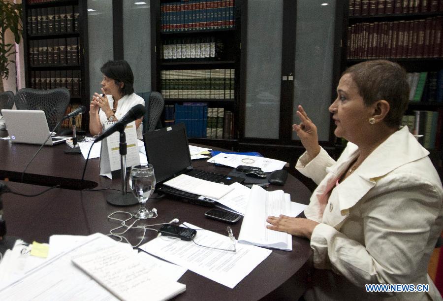 The President of the National Electoral Council of Venezuela (CNE, by its' acronym in Spanish), Tibisay Lucena (R), attends to an extraordinary meeting of the Council in the city of Caracas, capital of Venezuela, on March 9, 2013. Venezuela's National Electoral Council (CNE) announced Saturday after a special meeting of its Board of Directors that the presidential elections will be held on April 14. (Xinhua/Juan Carlos Hernandez)