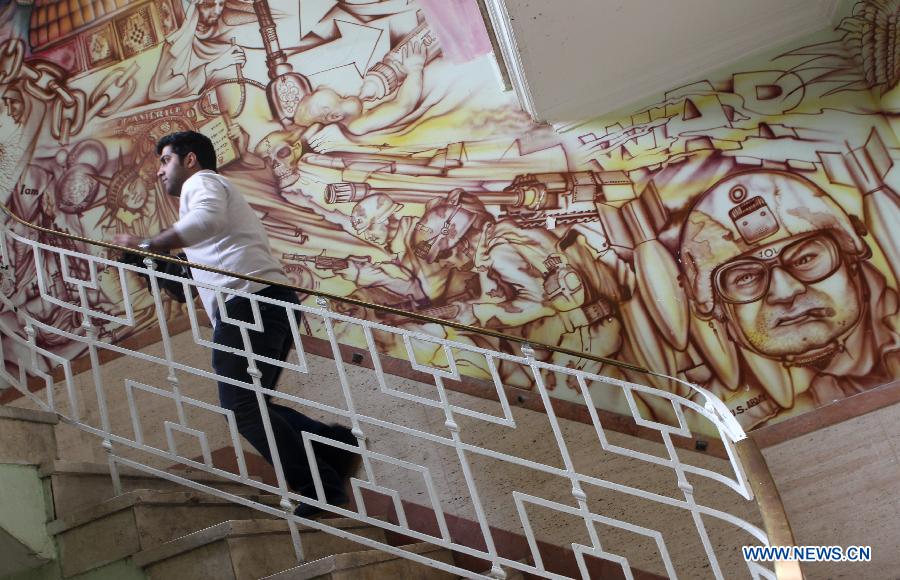 An Iranian Journalist visits inside the former U.S. embassy in downtown Tehran, Iran, March 10, 2013. The United States broke off diplomatic relations with Iran on April 7, 1980 after a group of Iranian students seized the U.S. embassy in Tehran and captured some 60 U.S. diplomats in 1979, with 52 of them being in captivity for 444 days in the hostage crisis. (Xinhua/Ahmad Halabisaz)