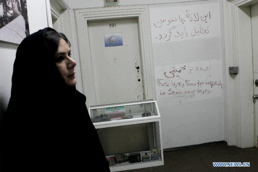 An Iranian staff member stands inside the former U.S. embassy in downtown Tehran, Iran, March 10, 2013. The United States broke off diplomatic relations with Iran on April 7, 1980 after a group of Iranian students seized the U.S. embassy in Tehran and captured some 60 U.S. diplomats in 1979, with 52 of them being in captivity for 444 days in the hostage crisis. (Xinhua/Ahmad Halabisaz)